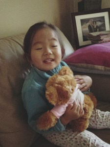 Naomi cuddling 'mummy-daddy bear'